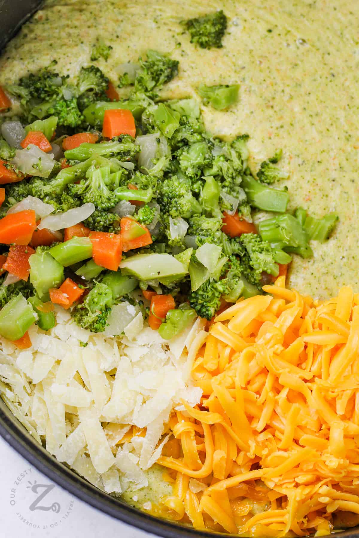 close up of Broccoli Cheese Soup ingredients in pot