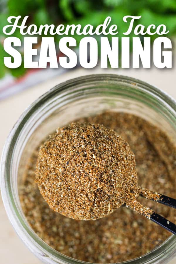 top view of Taco Seasoning in a jar and on a spoon with writing
