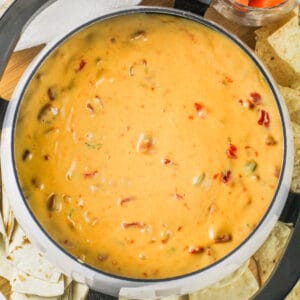 top view of Velveeta Rotel Dip in the pot with crackers and chips