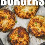 cooked Air Fryer Chicken Burgers in the fryer with writing