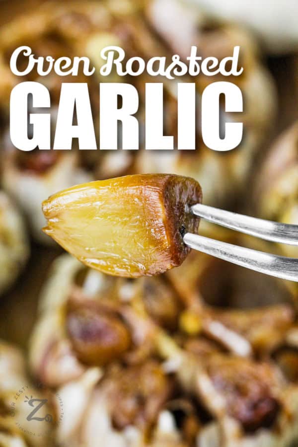 Roasted Garlic on a fork with a title