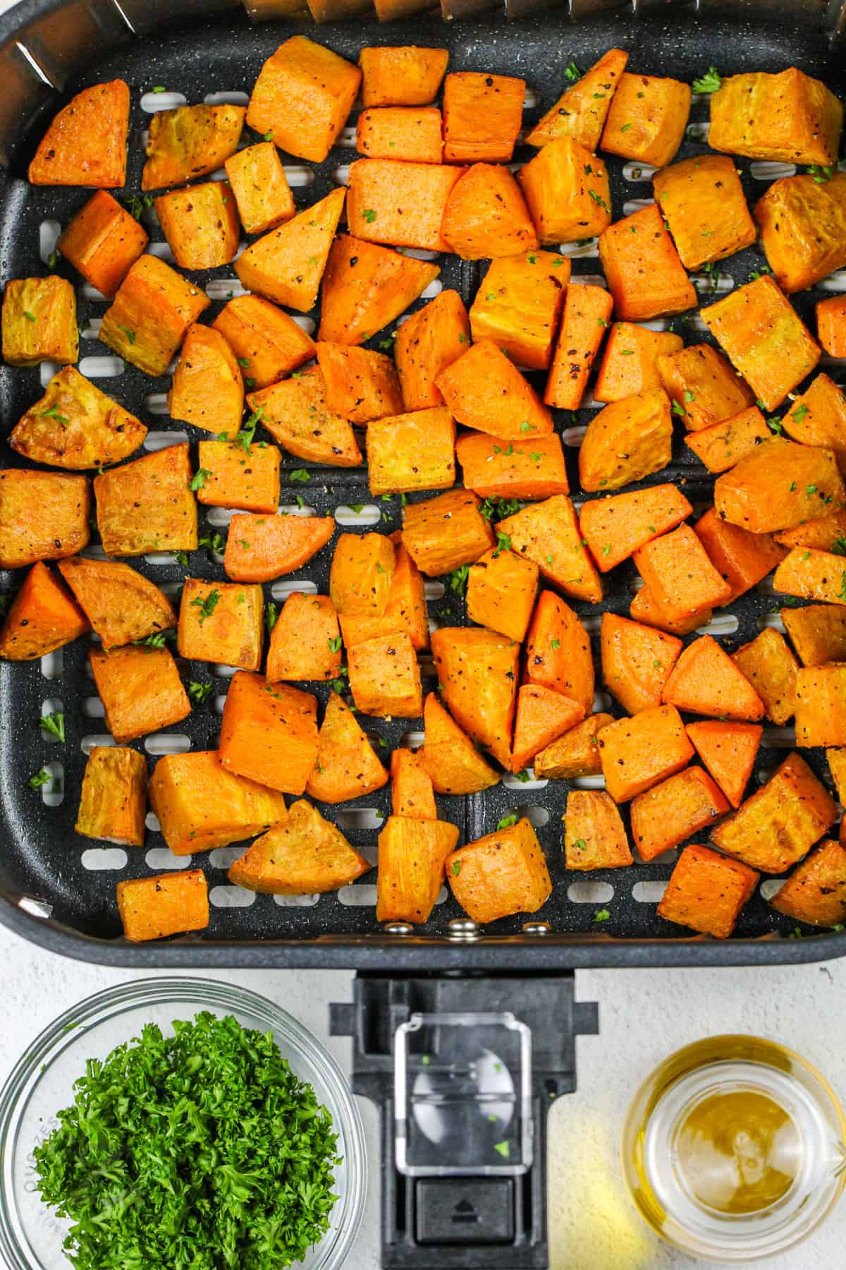 cooked Air Fryer Roasted Sweet Potatoes in the fryer
