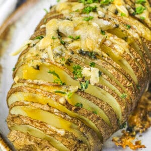 close up of Hasselback Potatoes on a plate