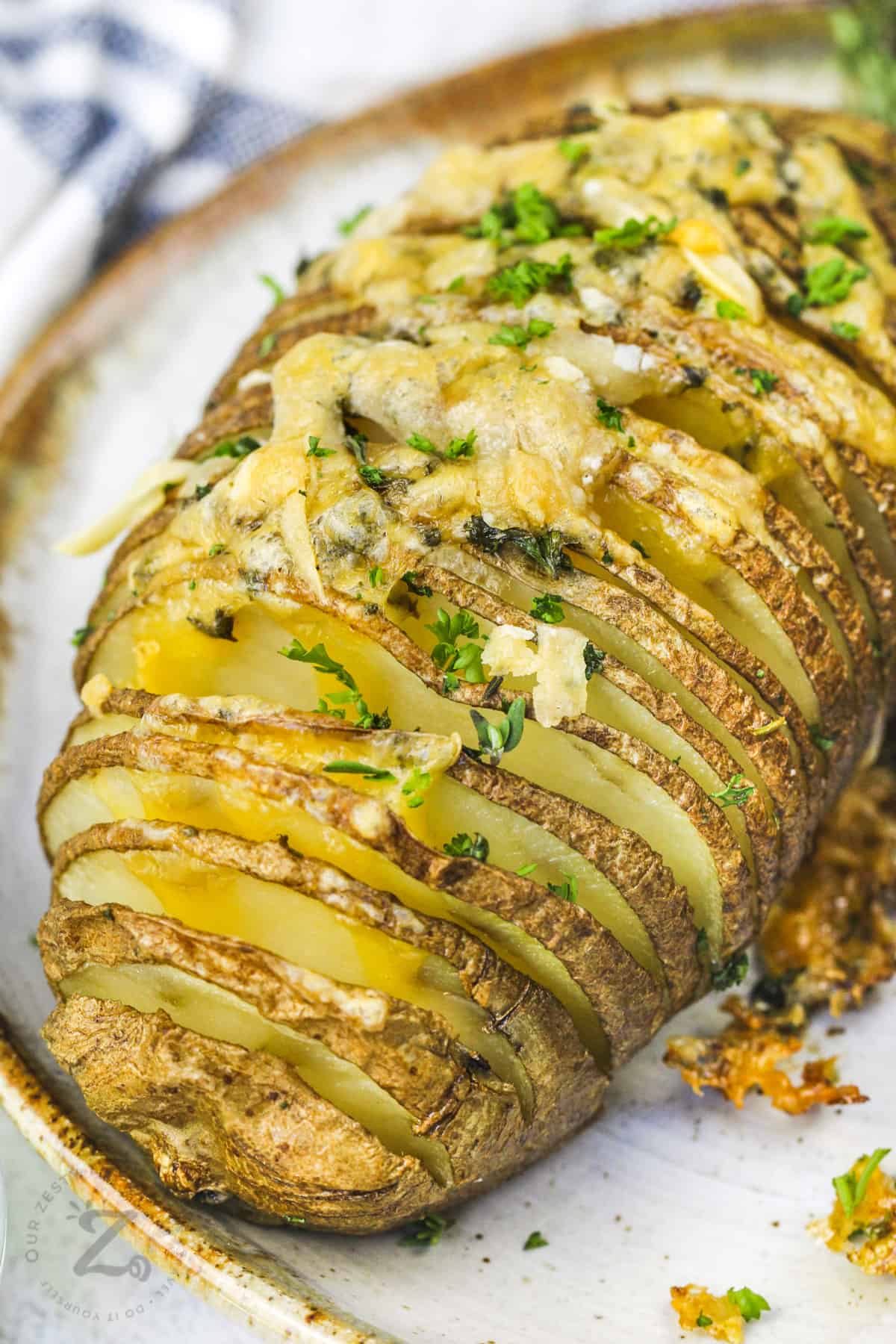 close up of Hasselback Potatoes on a plate