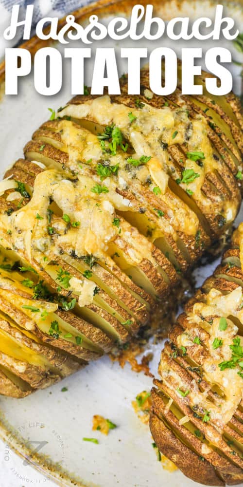 close up of Hasselback Potatoes on a plate with a title
