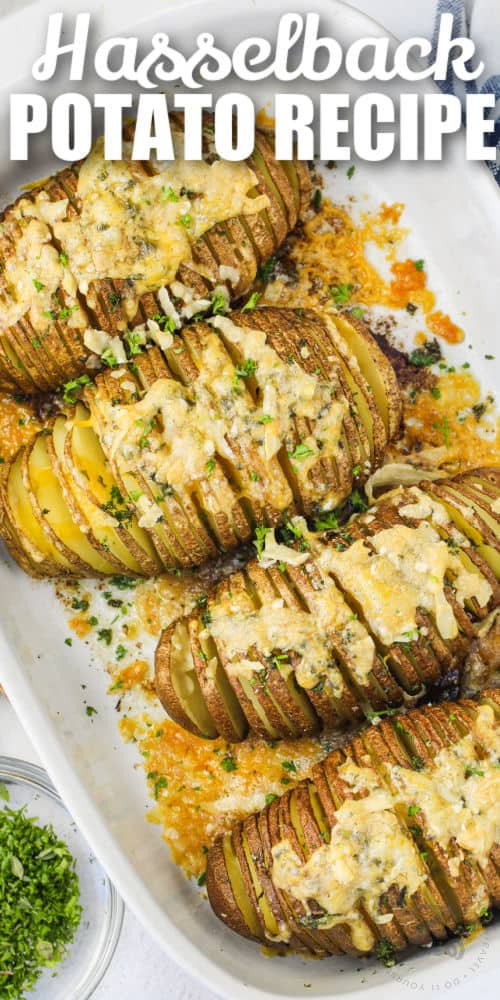 cooked Hasselback Potatoes in the pan with a title