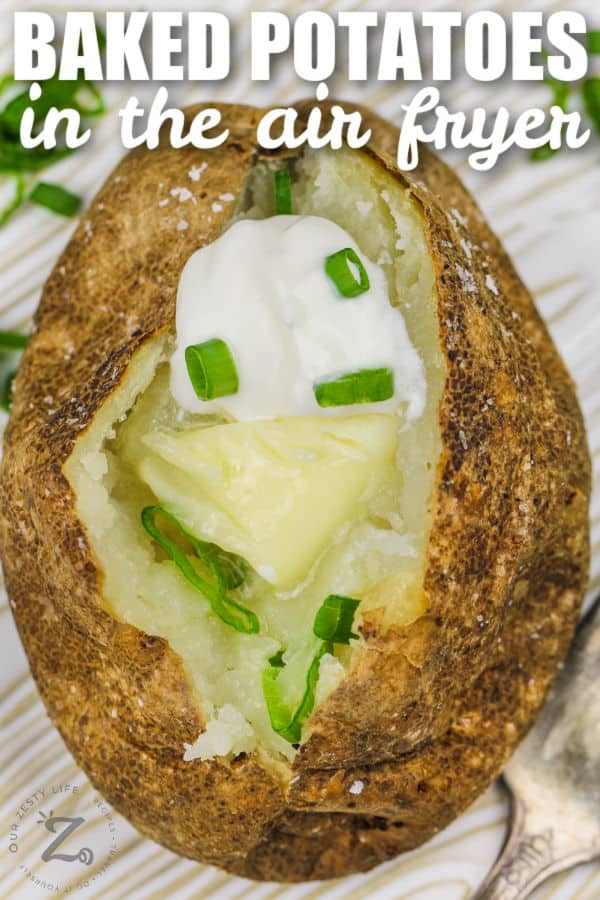 Air Fryer Baked Potatoes with sour cream and butter with writing