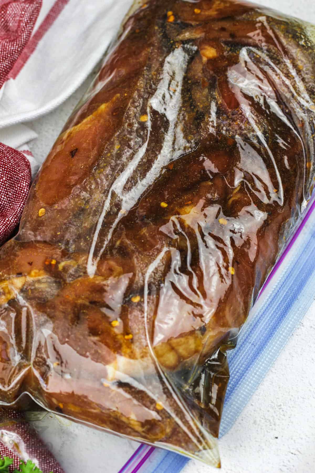 pork marinating in a bag to make Baked Pork Tenderloin