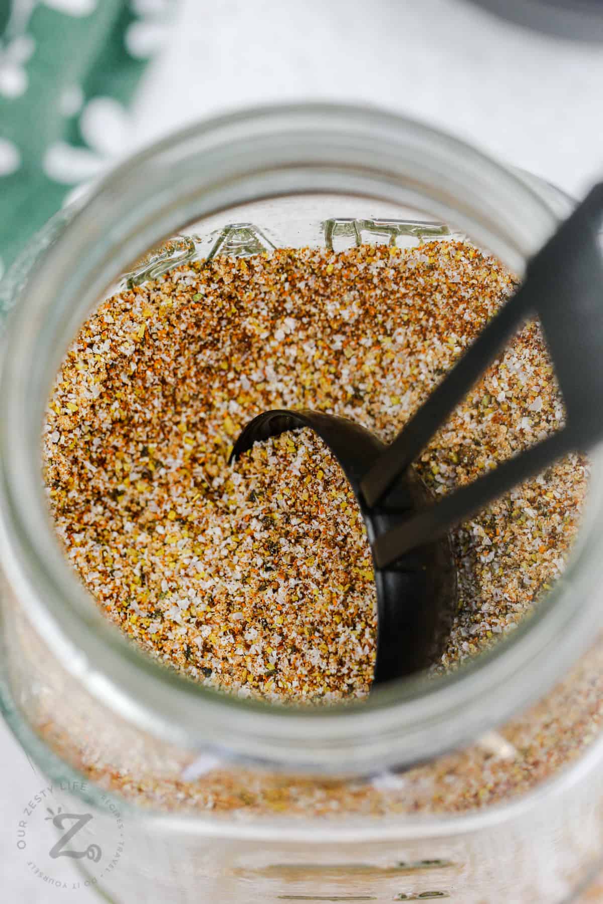 jar of Smoked Chicken Rub with a spoon
