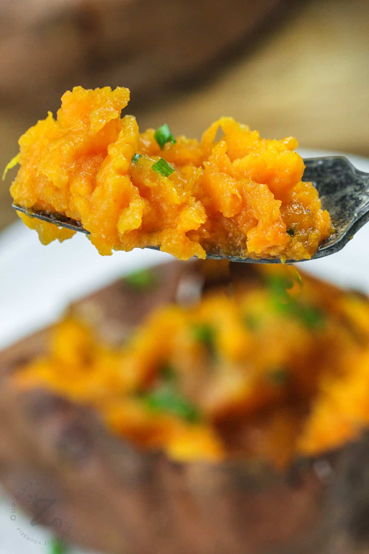 Air Fryer Baked Sweet Potato on a fork