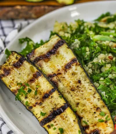 Grilled Zucchini with salad on a plate