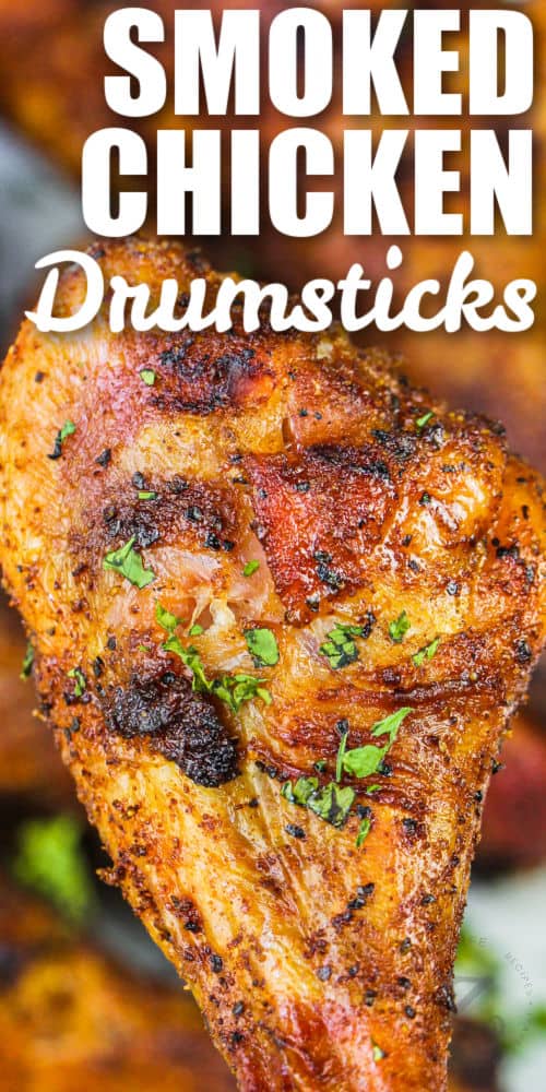 close up of Smoked Chicken Drumsticks with writing