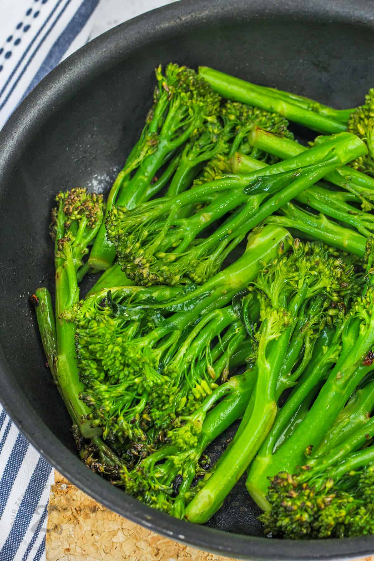 Sauteed Broccolini cooking in the pan