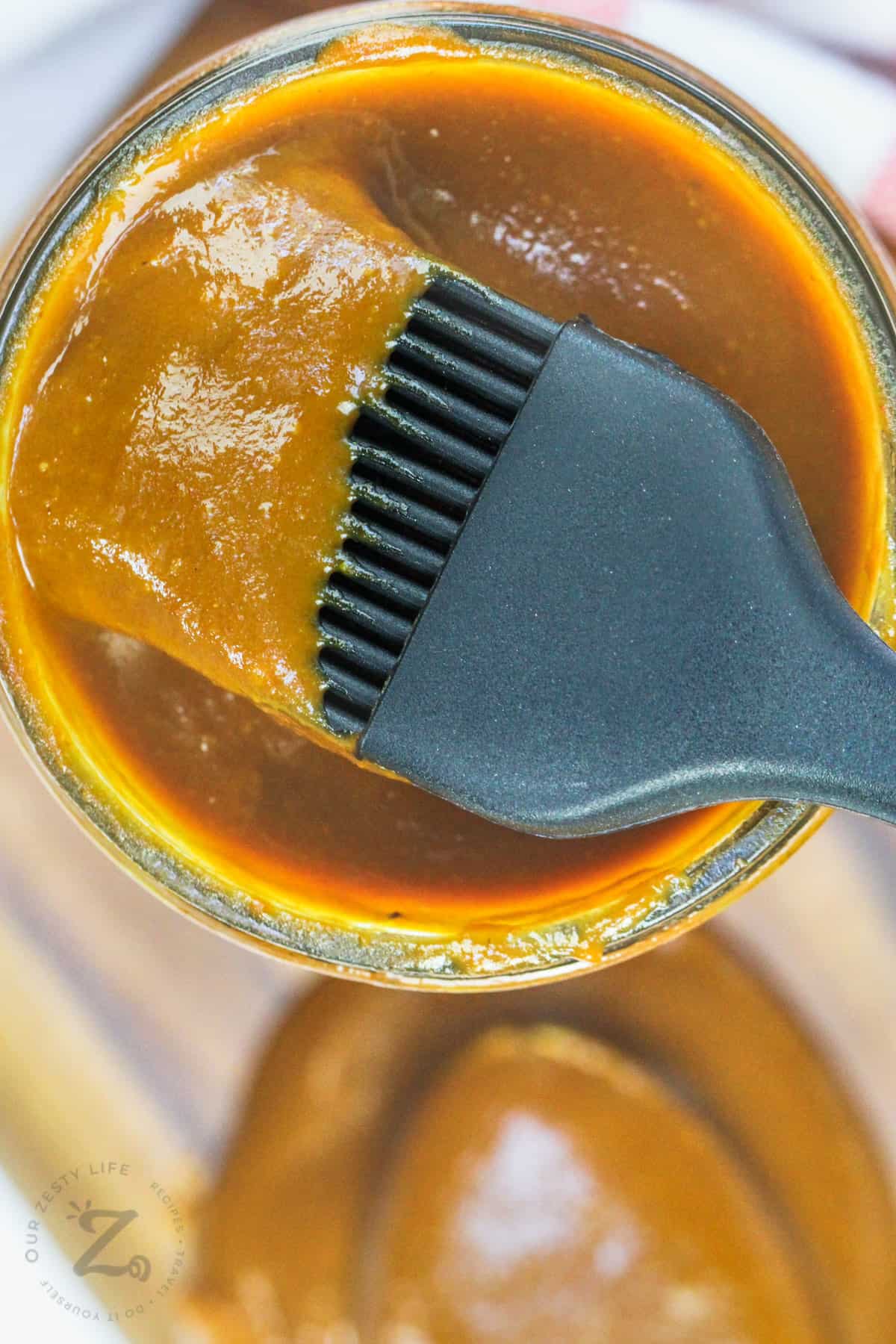 close up of Carolina Gold BBQ Sauce on a brush