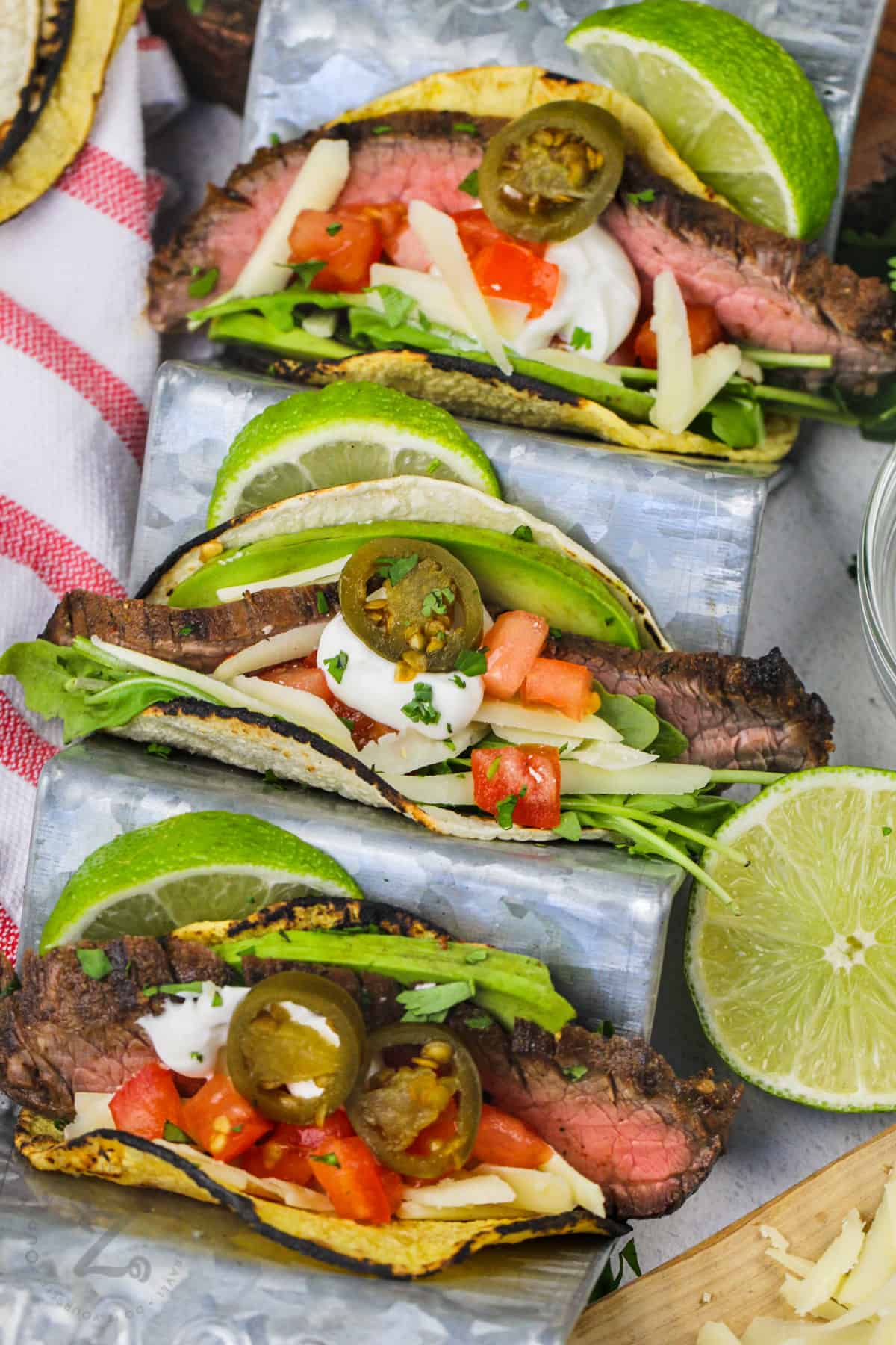 Flank Steak Tacos with toppings plated