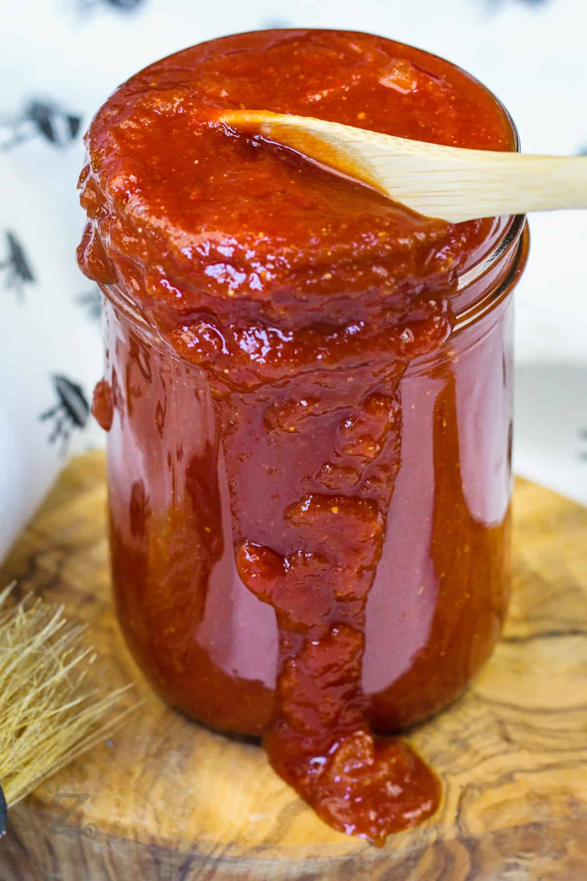 jar of Homemade Barbecue Sauce with a spoon