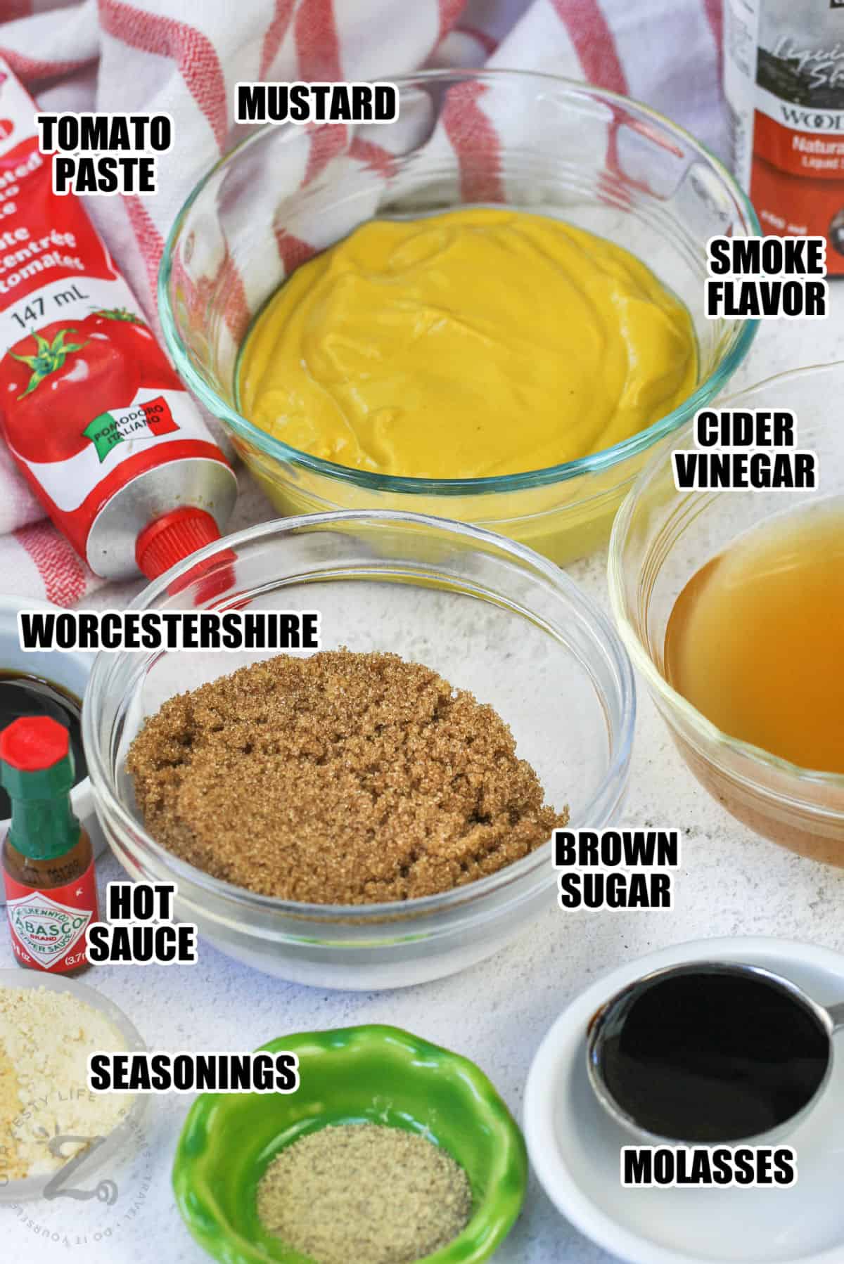 mustard , tomato paste , brown sugar , hot sauce and ingredients to make Carolina Gold BBQ Sauce with labels