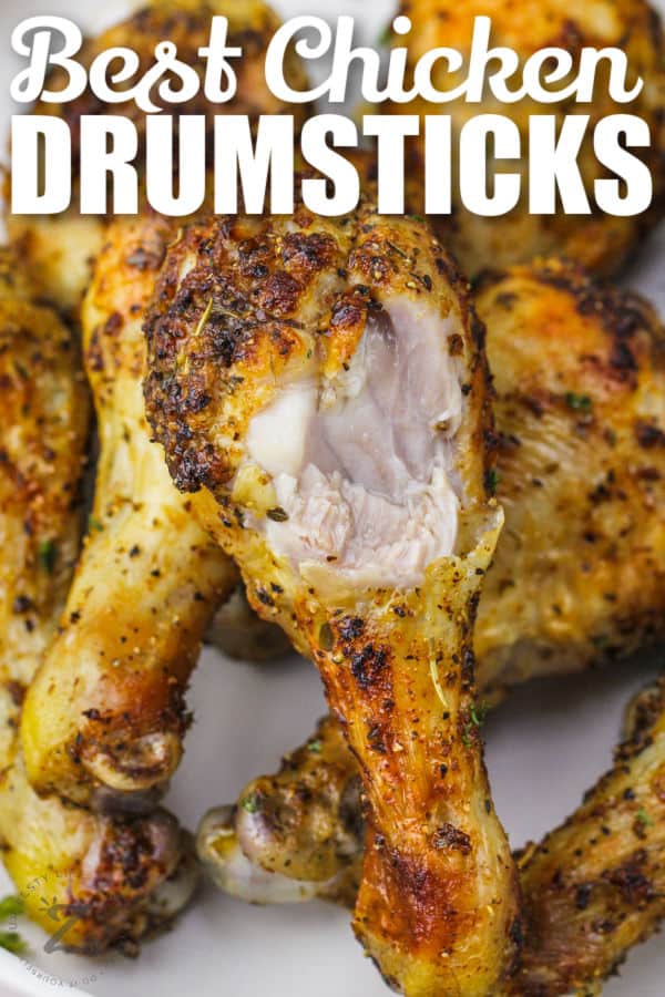plated Air Fryer Chicken Drumsticks with a bite taken out and writing