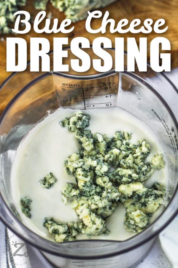 close up of adding cheese to dressing to make Blue Cheese Dressing with a title