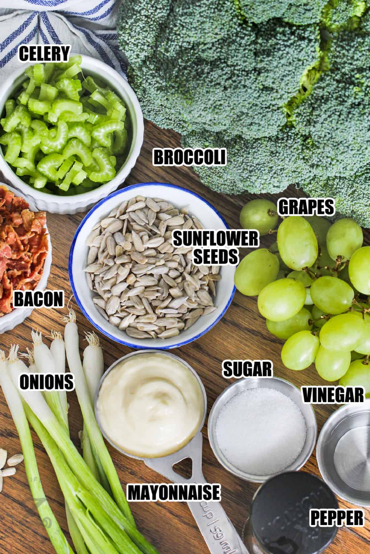 broccoli , celery , grapes , onions , bacon , mayo and other ingredients with labels to make Broccoli Grape Salad
