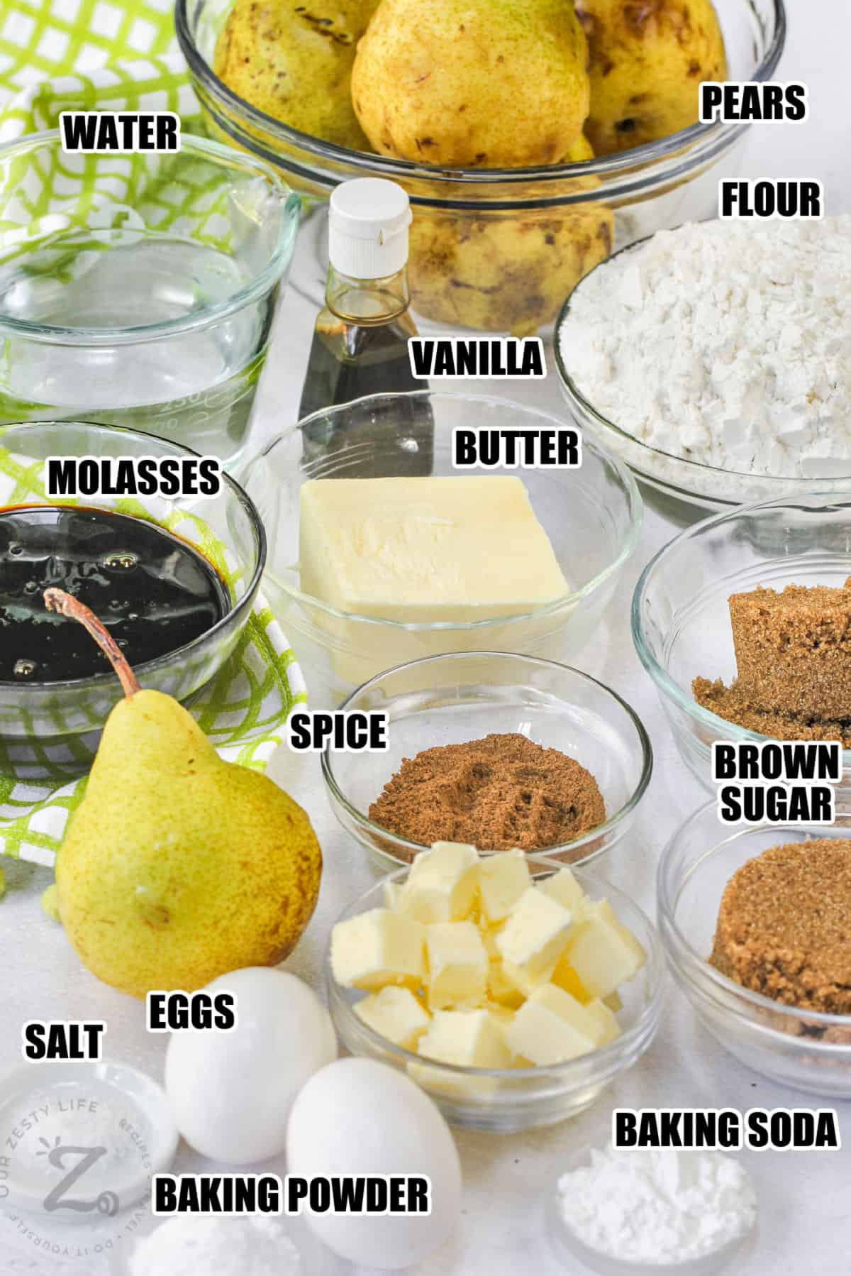 pears , flour , molasses , butter , sugar , spices and eggs with other ingredients to make Pear Upside Down Cake with labels
