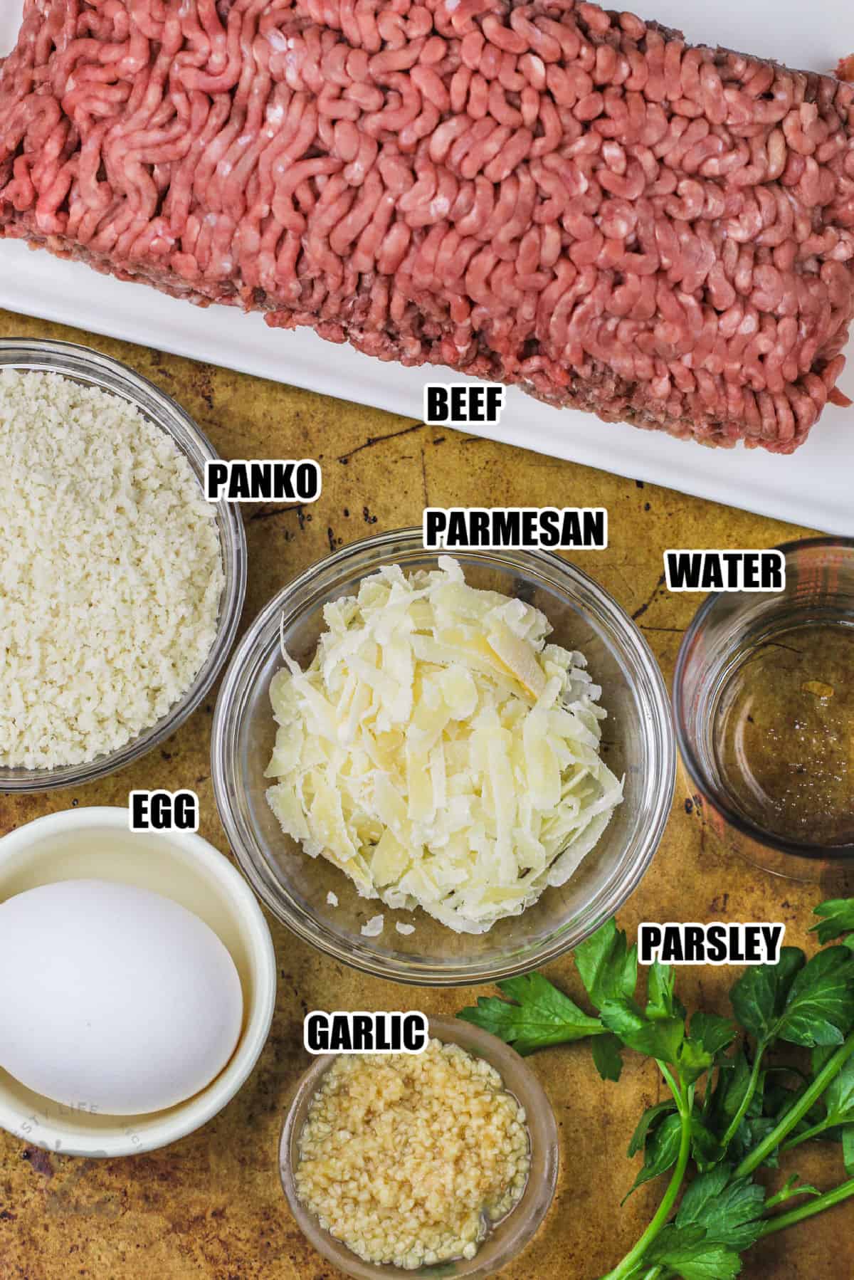 beef , parmesan , parsley , egg , garlic , Panko and water to make Smoked Meatballs with labels