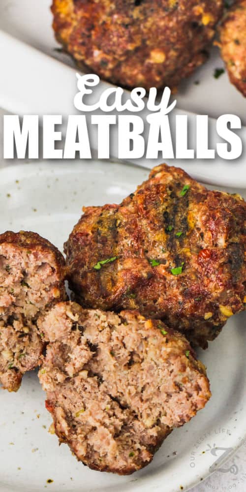 Smoked Meatballs on a plate with one meatball in half with a title