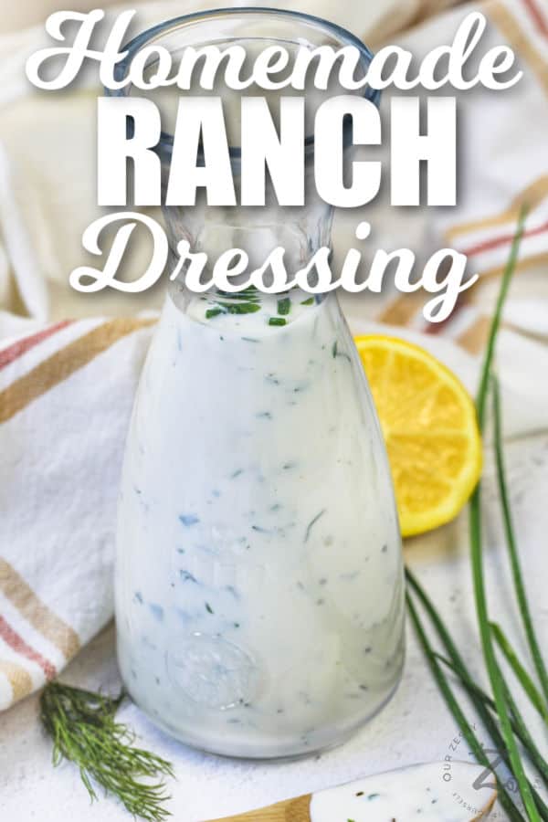 Homemade Ranch Dressing in a jar and on a wooden spoon with writing