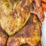 close up of Spatchcock Smoked Turkey cooked on a sheet pan