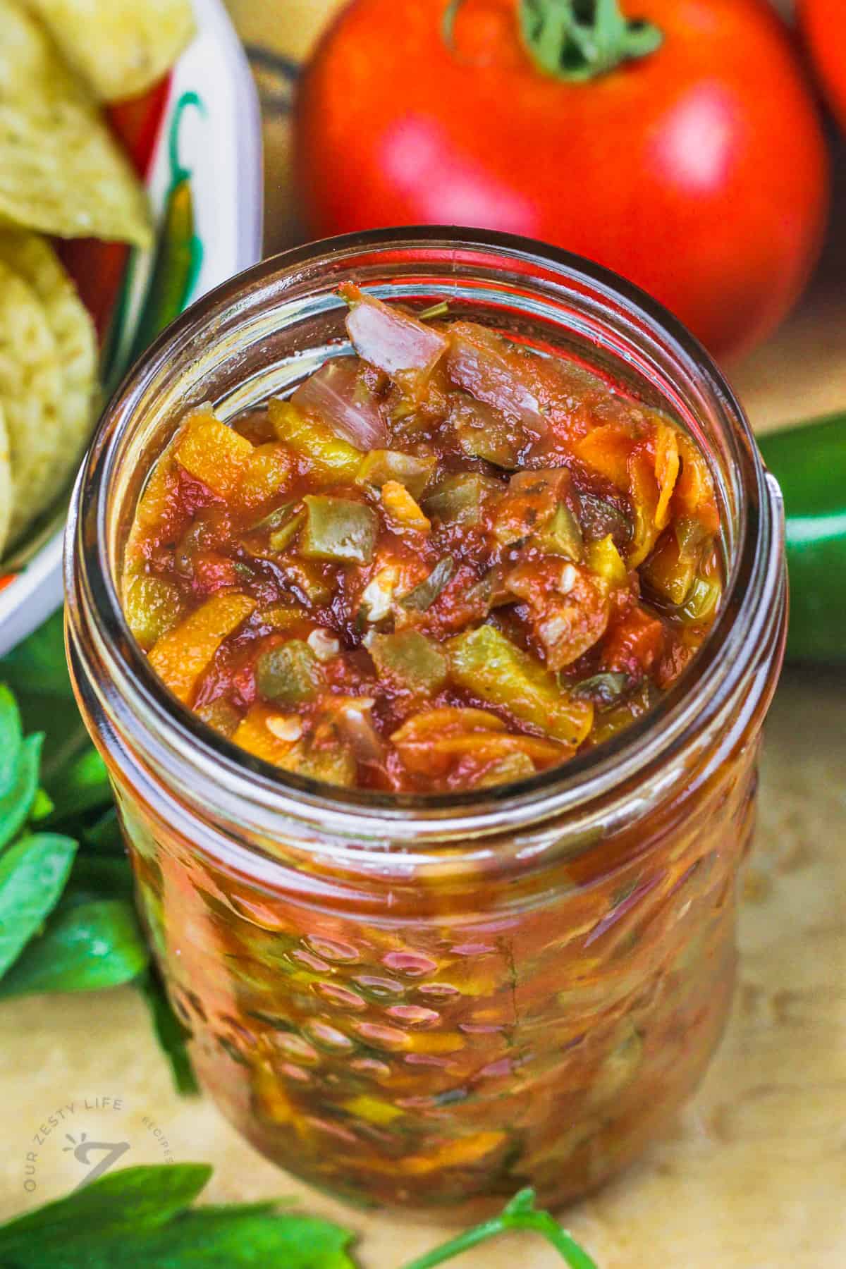 jar of Garden Salsa with vegetables and chips