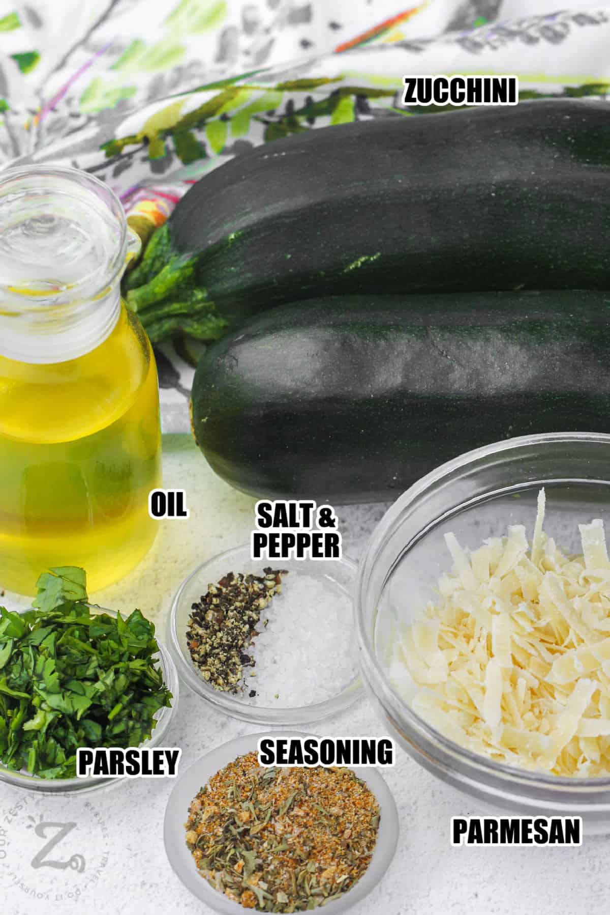 zucchini , oil , parmesan , parsley and seasoning to make Baked Parmesan Zucchini with labels