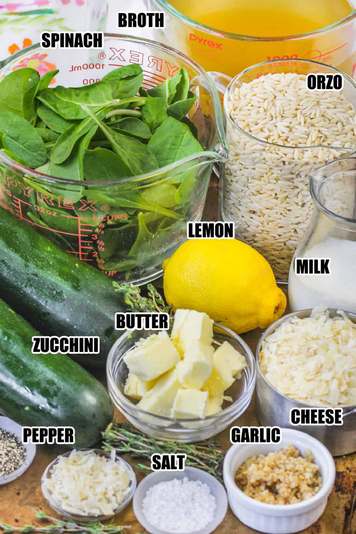 spinach , broth , zucchini , butter , orzo pasta , lemon , milk , cheese garlic and seasonings to make Lemon Orzo with Zucchini