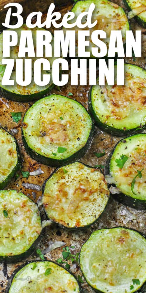 Baked Parmesan Zucchini on a sheet pan with a title