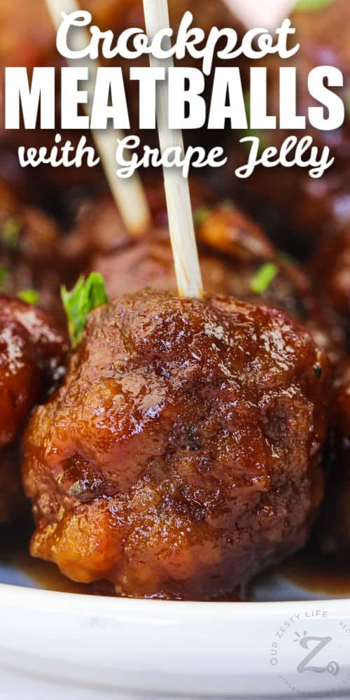 close up of Grape Jelly Meatballs on a plate with writing