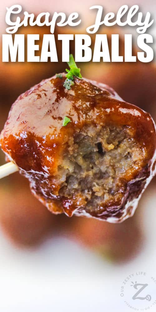 Grape Jelly Meatballs with a bite taken out of one with writing