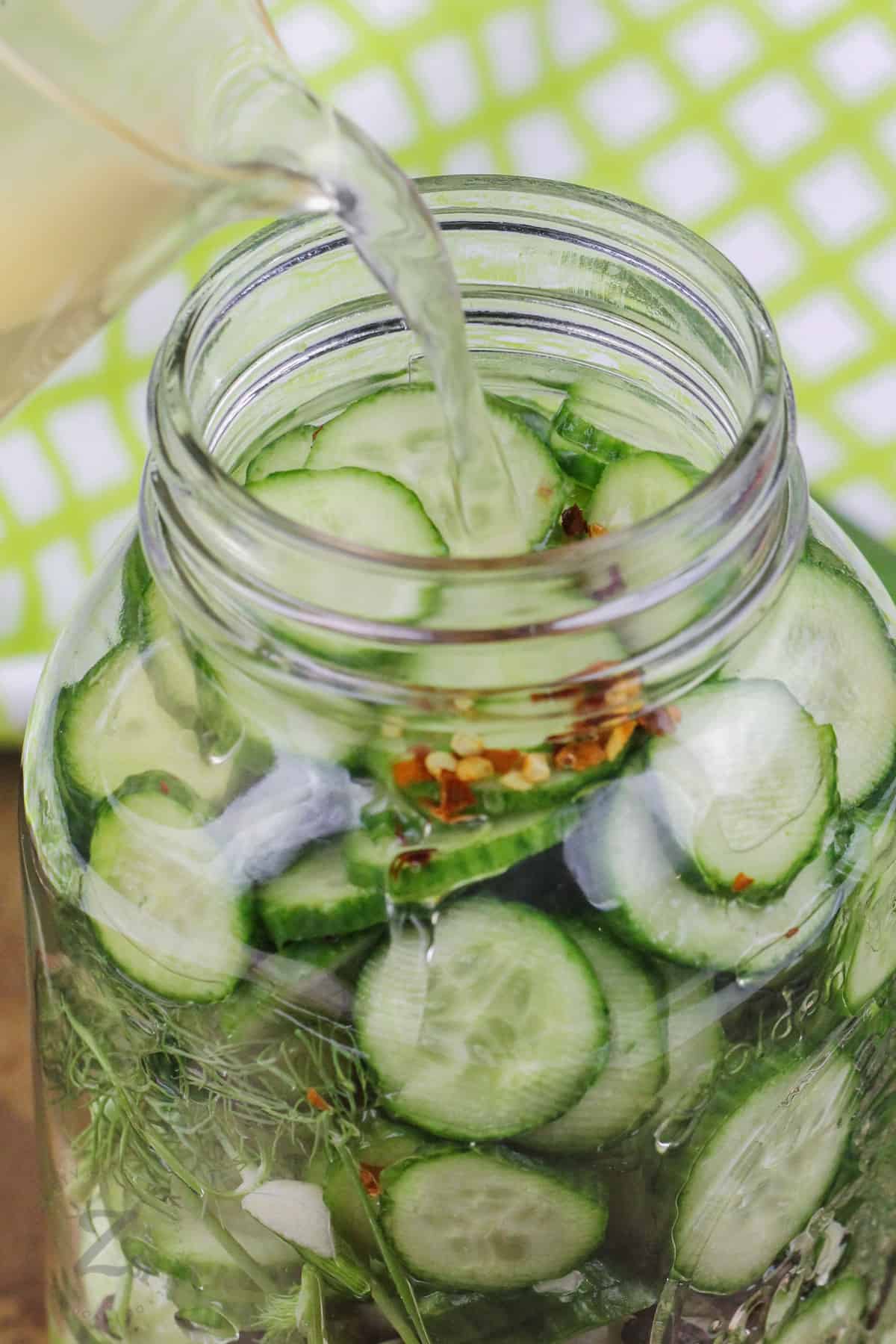adding wet ingredients to jar to make Quick Pickles