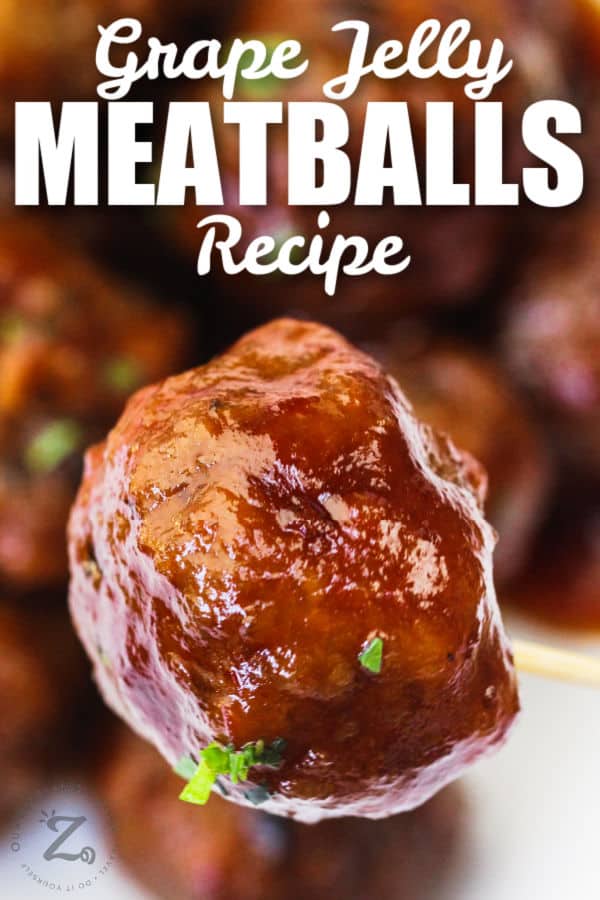 close up of Grape Jelly Meatballs with one on a toothpick and writing