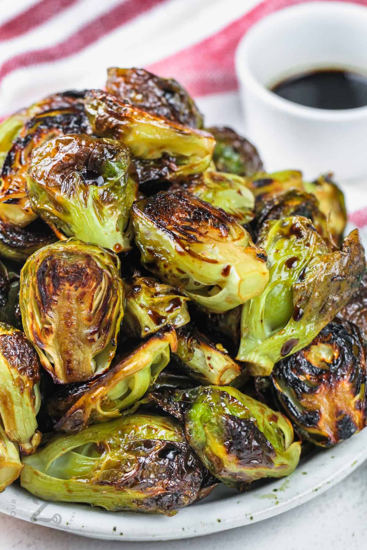 balsamic brussels sprouts on a white plate