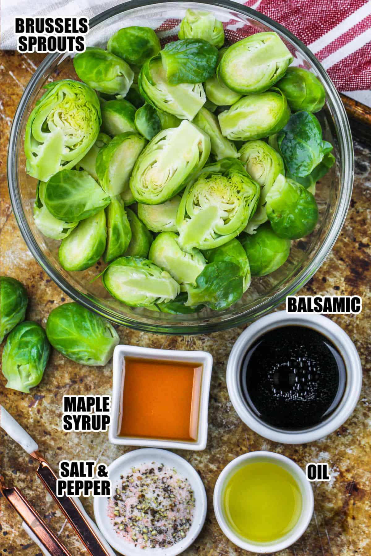 brussels, maples syrup, balsamic vinegar, oil, salt and pepper assembled to make balsamic brussels sprouts