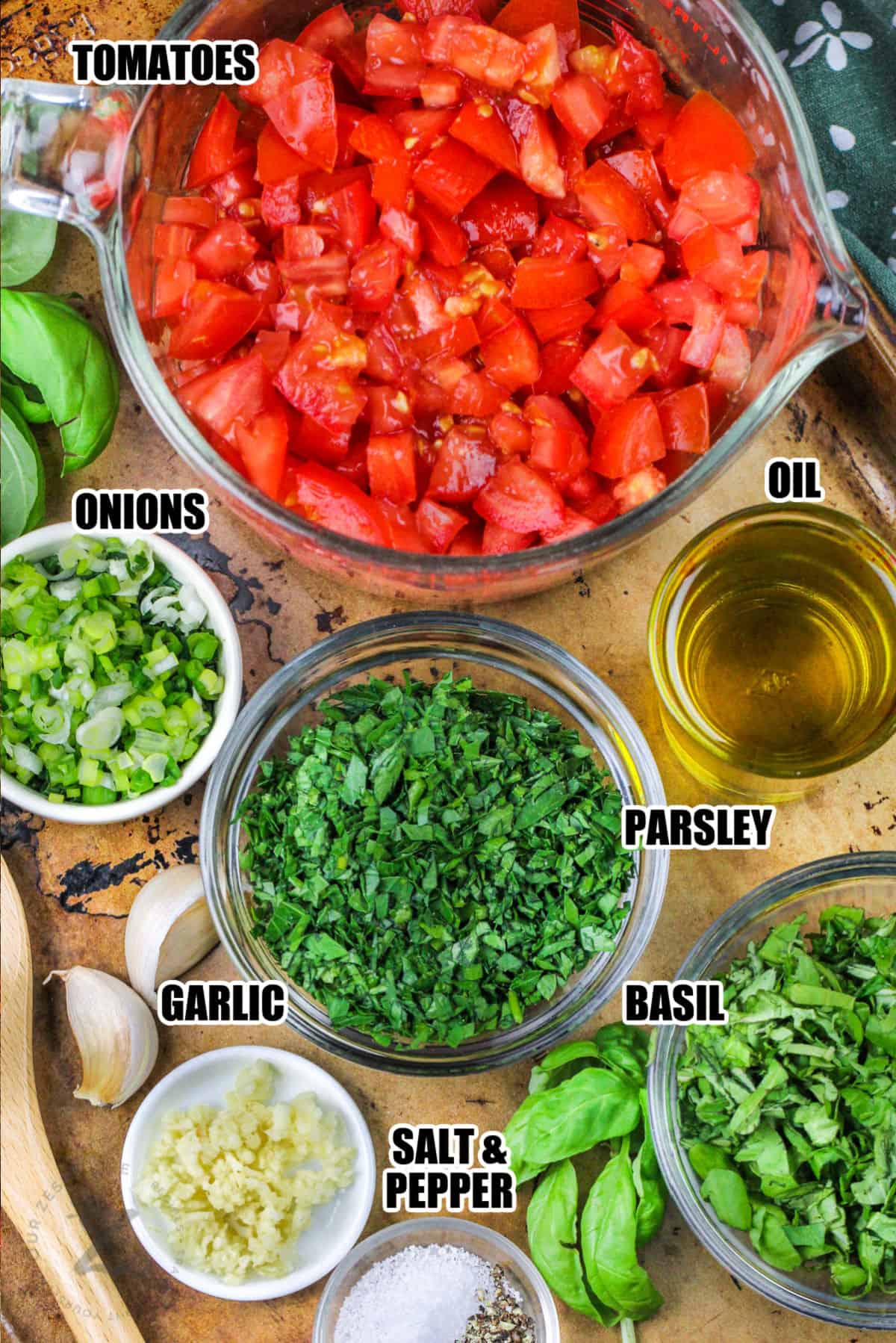 tomatoes, onions , oil , garlic , parsley , basil and salt and pepper to make Best Bruschetta Recipe with labels