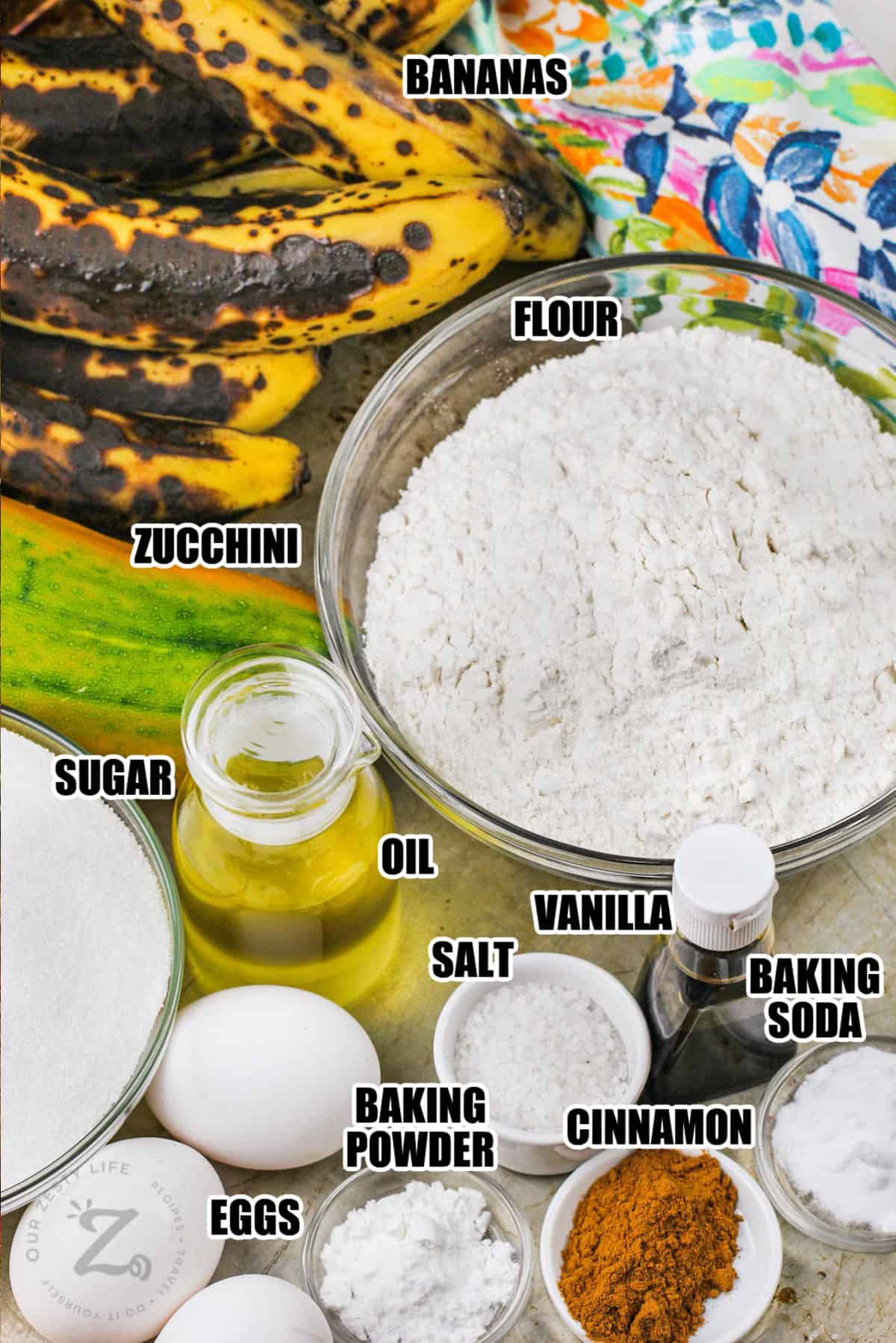 bananas , flour , zucchini , sugar , oil , vanilla , eggs and spices to make Zucchini Banana Bread with labels