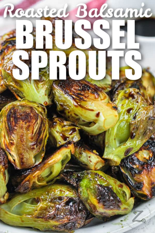 balsamic brussels sprouts on a white plate, with a title