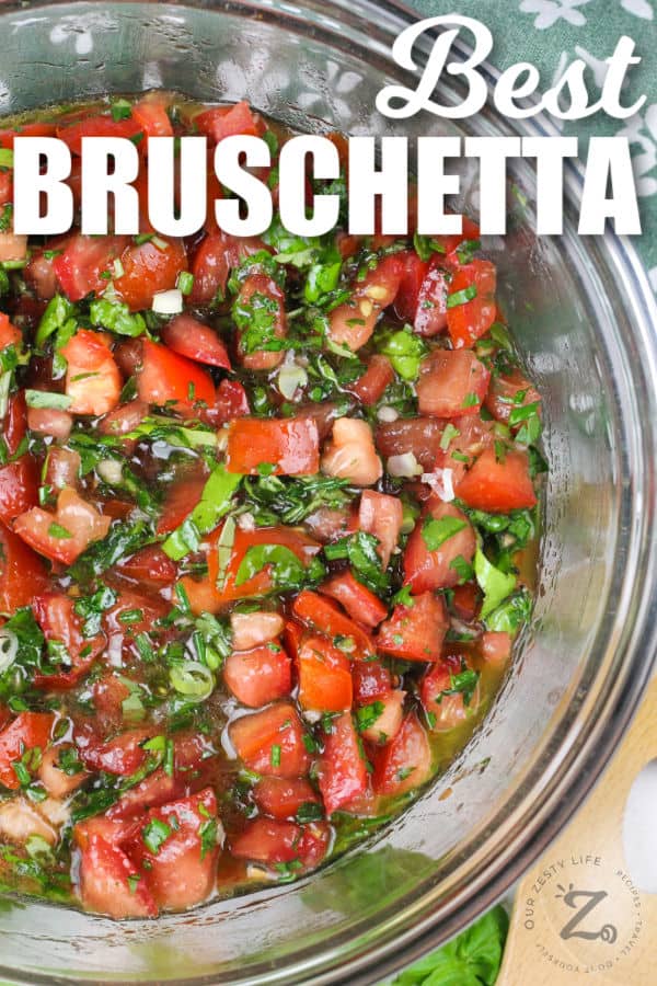 mixed ingredients in a bowl to make Best Bruschetta Recipe with a title