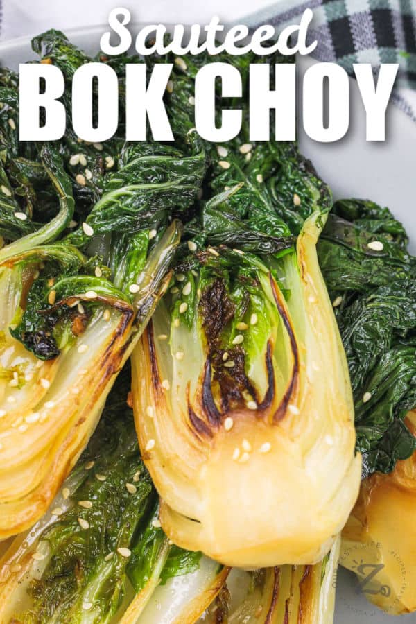 garlic baby bok choy served in a white bowl, with writing