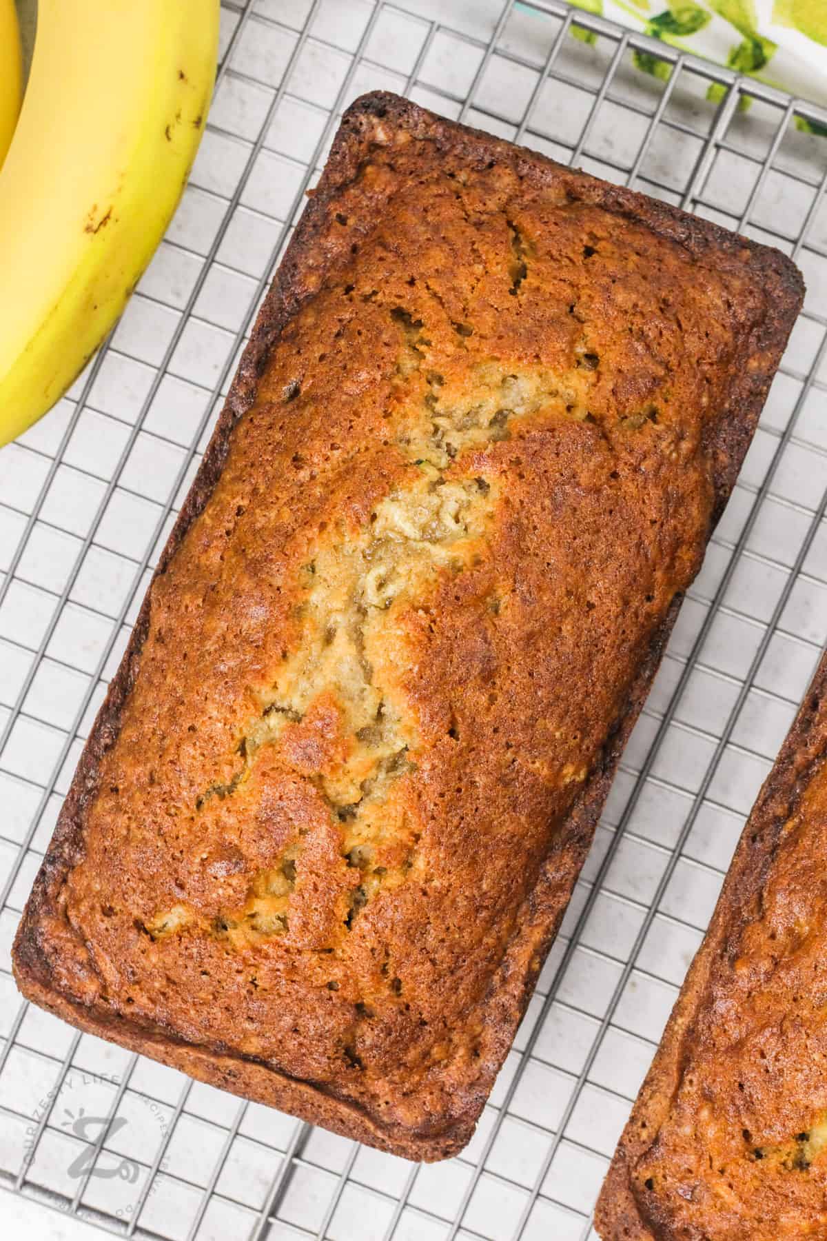 Zucchini Banana Bread cooling on a rack