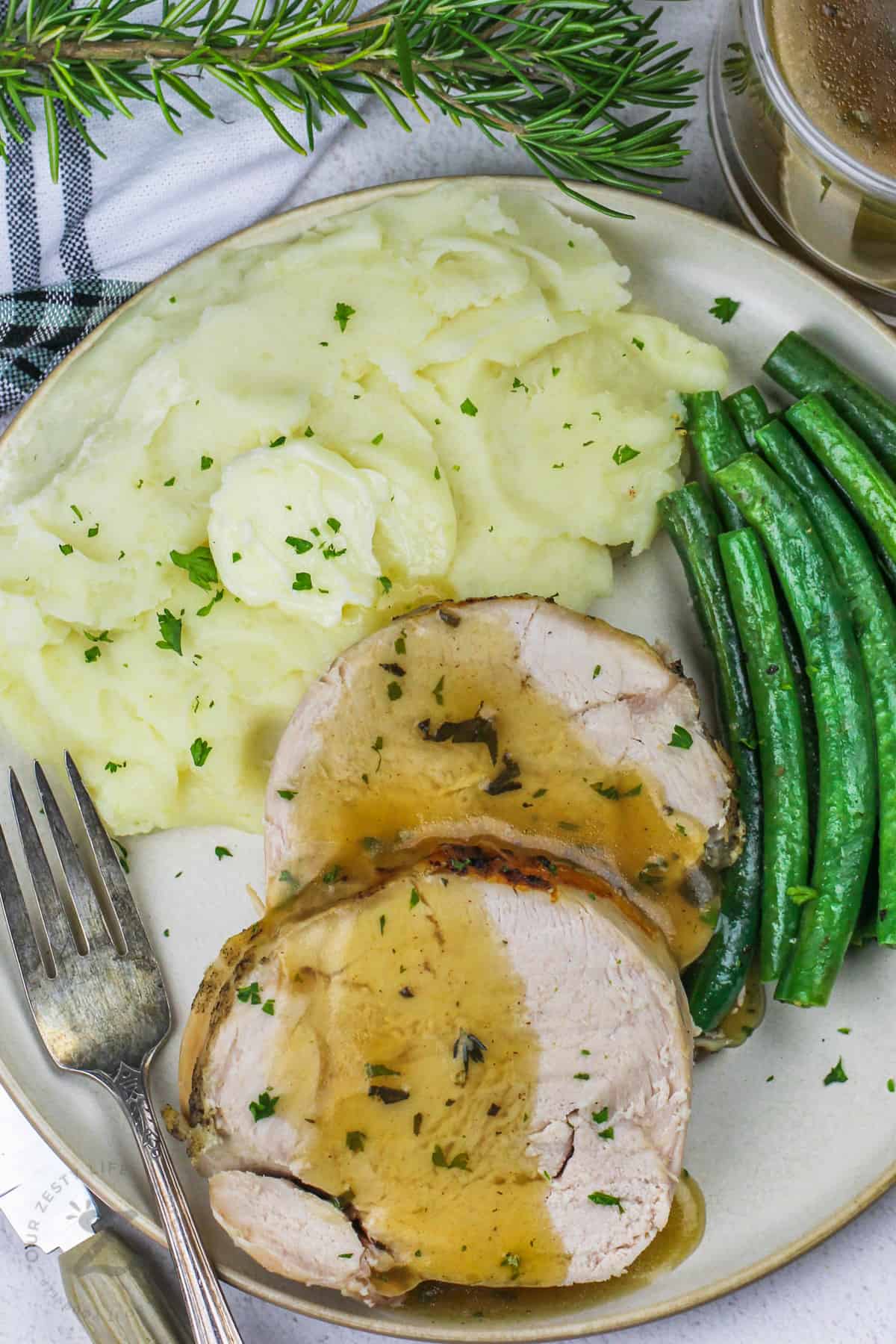 top view of Instant Pot Turkey Breast with beans and potatoes on a plate