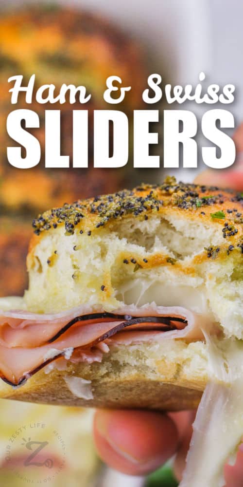 close up of holding Ham and Swiss Sliders with a title
