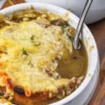 spoon in a bowl of Crockpot French Onion Soup