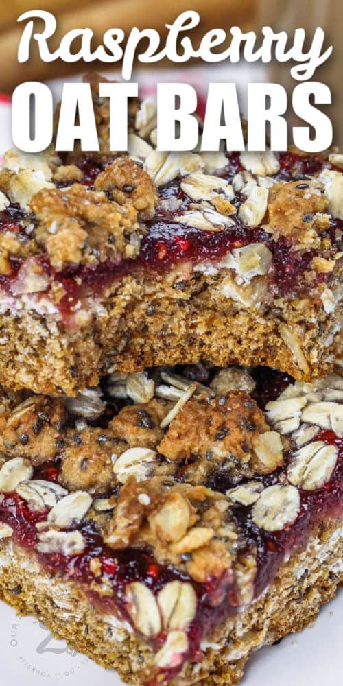 close up of Raspberry Oat Bars with writing