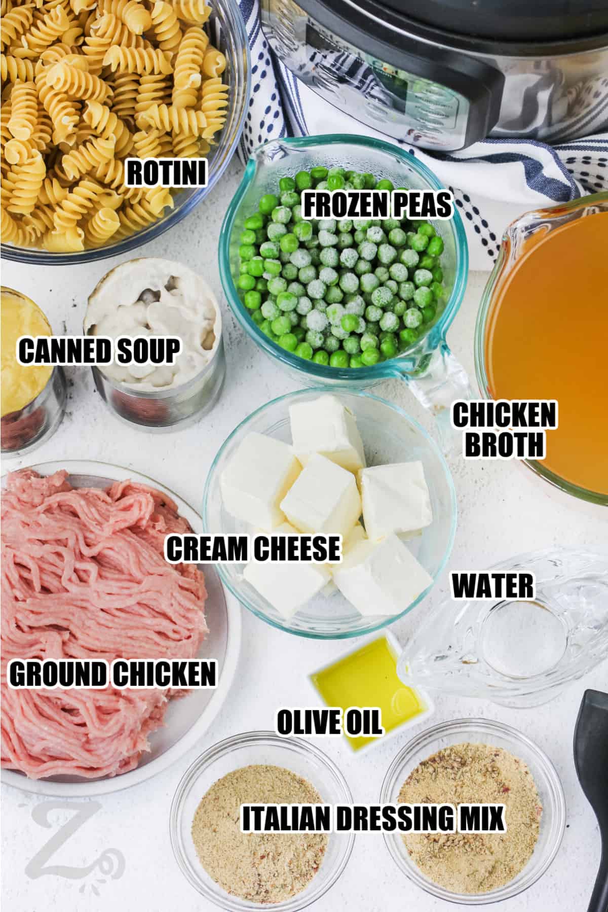 ingredients to make instant pot chicken and noodles labeled: frozen peas, rotini, chicken broth, canned soup, cream cheese, ground chicken, water, olive oil, Italian dressing mix